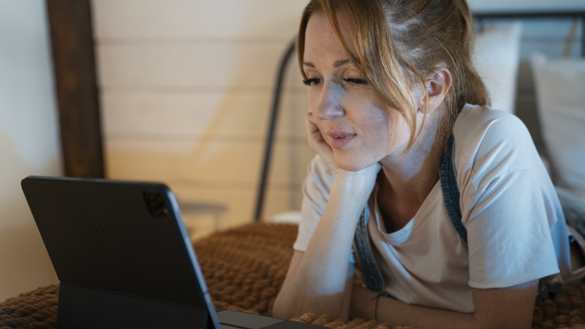 young-woman-watching-movie-streaming-service-home